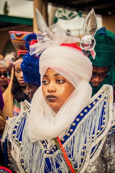 Colorful traditional African attire worn by individuals in a cultural festival setting.